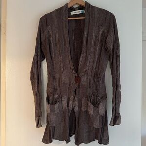 Textured sweater with button and pockets